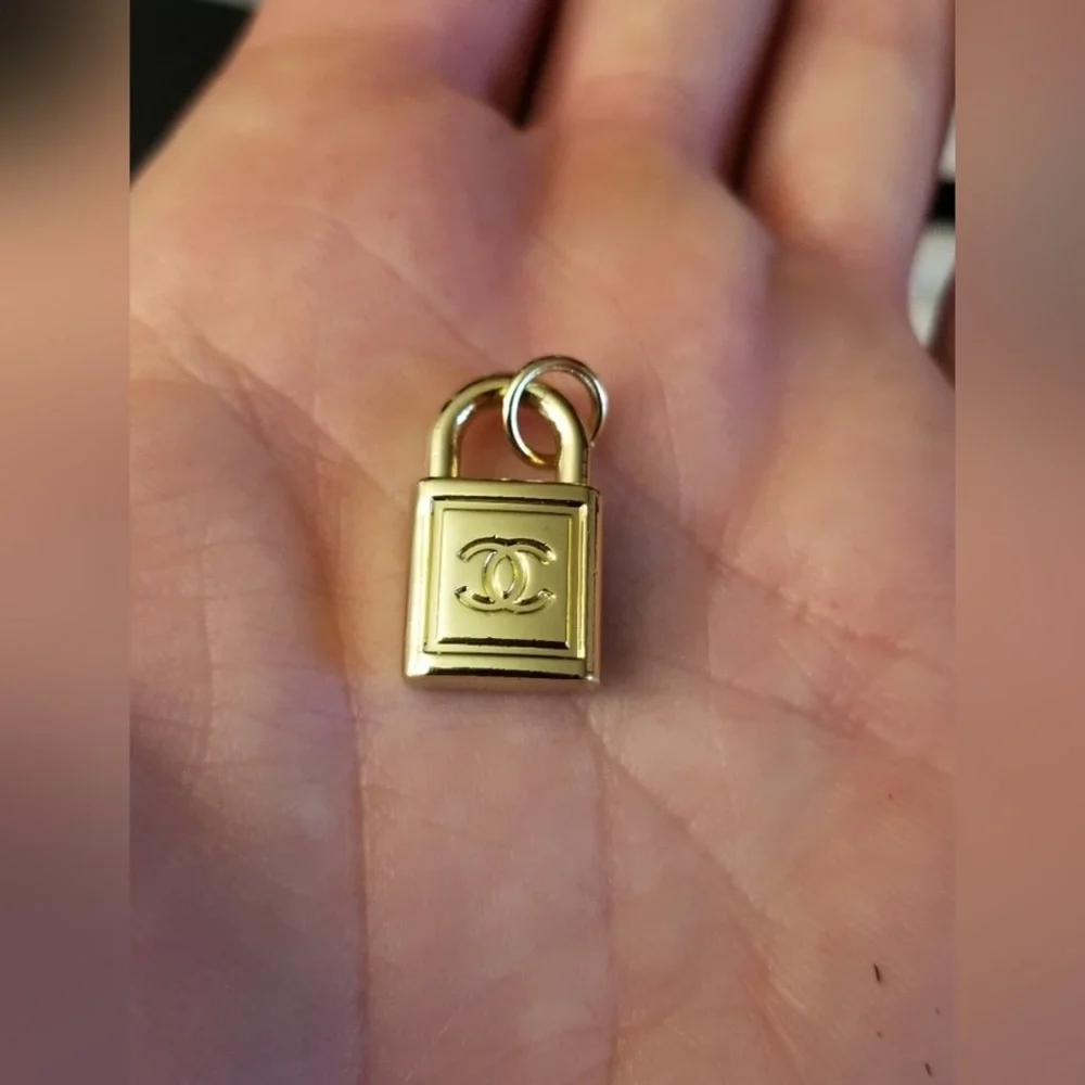 CHANEL- Gold Padlock Charm Pendant with CC Logo